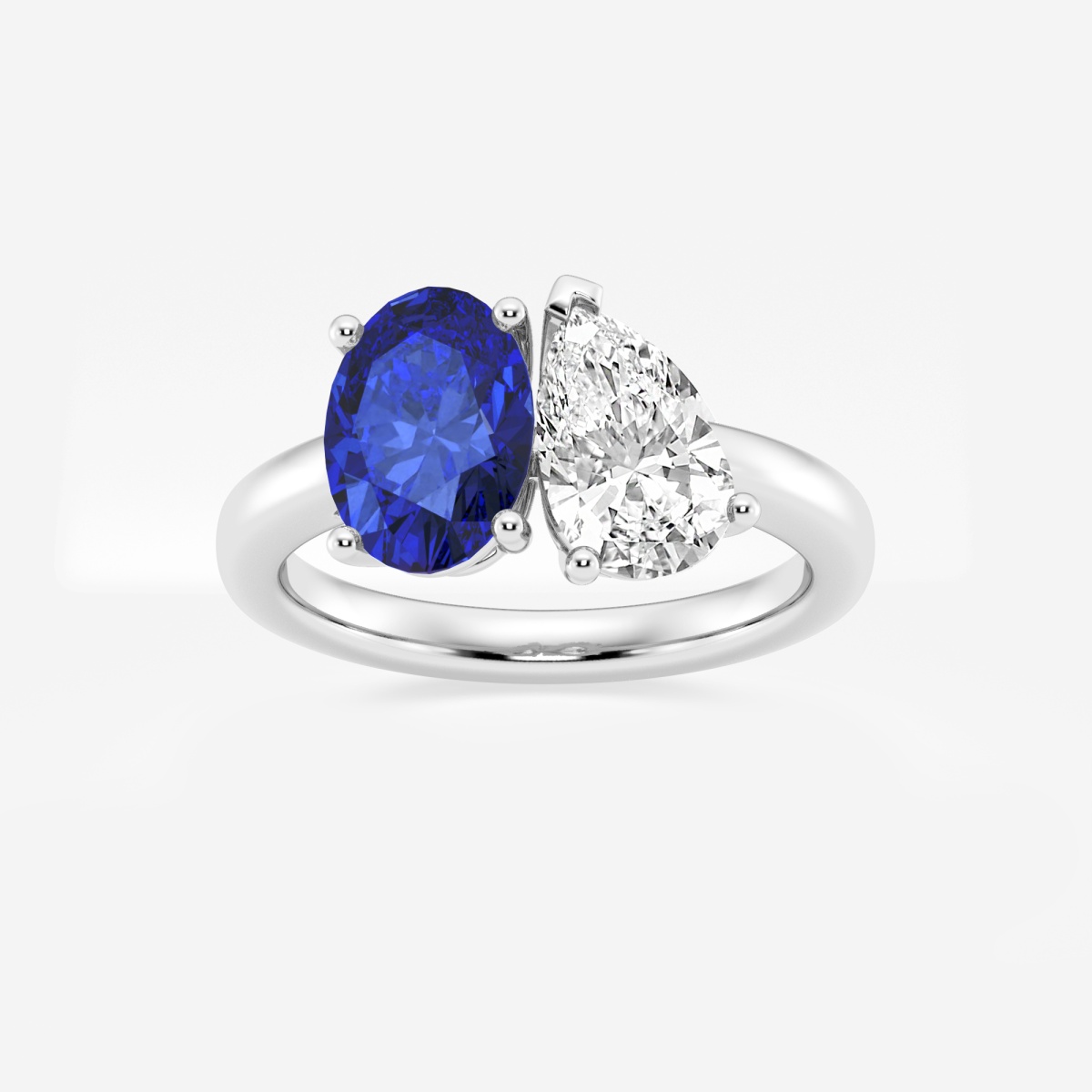 9x7mm Oval Cut Created Sapphire and 1 1/2 ctw Pear Cut Lab Grown Diamond Two Stone Engagement Ring